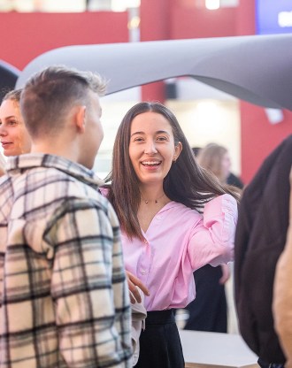 Smiling student at the Chambéry campus of the INSEEC business school